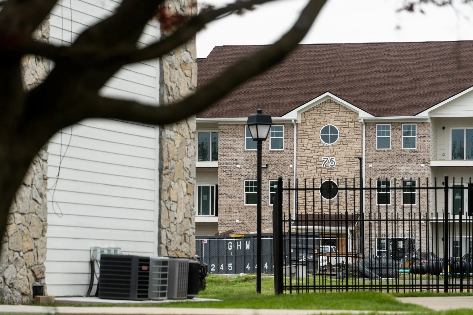 Ongoing multifamily apartment construction with brick and siding by AY Remodeling & Restoration