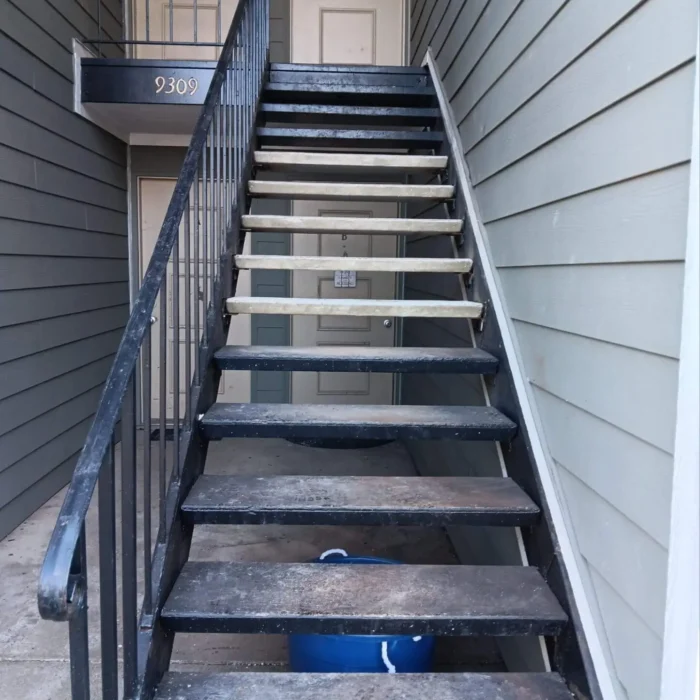Repaired metal stair treads after restoration, showing reinforced steps at a residential property in Indiana as part of our repair services.