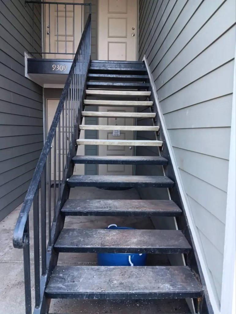Repaired metal stair treads after restoration, showing reinforced steps at a residential property in Indiana as part of our repair services.