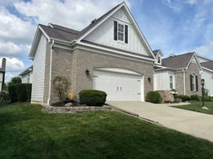 Exterior painting services by AY Remodeling & Restoration on a brick and white siding home in Fishers, Indiana