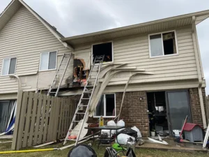 Before fire and smoke damage restoration showing exterior fire damage to a townhome, prior to repairs by AY Remodeling & Restoration in Indiana