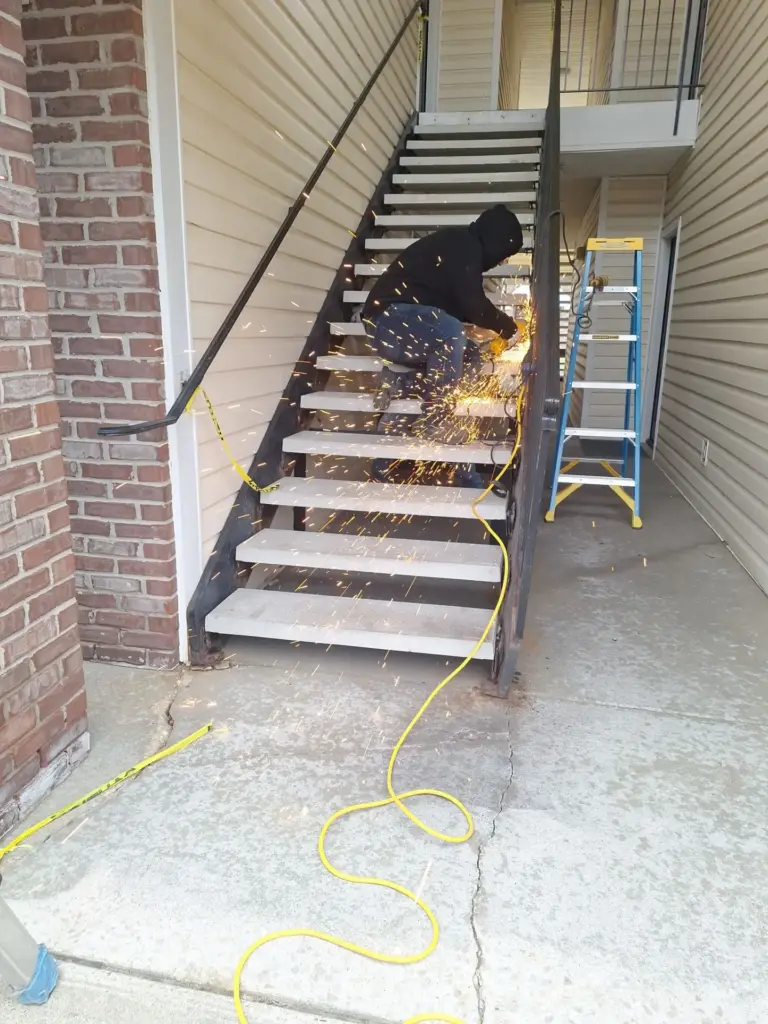 Metal stair repair in progress at Barton Farms Apartments in Greenwood, Indiana