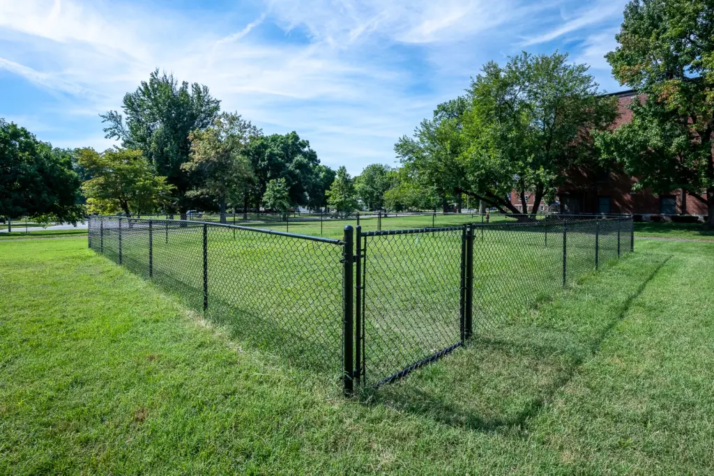 Commercial chain link dog park fence installation at Crestview at Louisville Apartments in Louisville, Kentucky by AY Remodeling & Restoration.