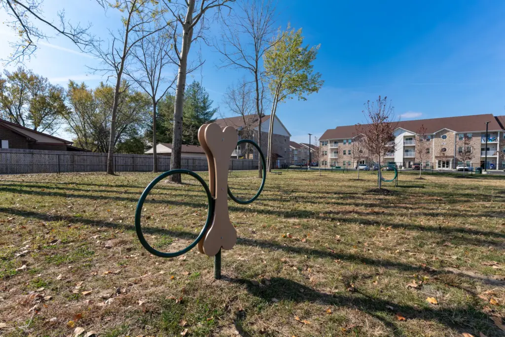 Dog park installation at Sandstone Apartments in Greenwood, Indiana with custom pet play equipment