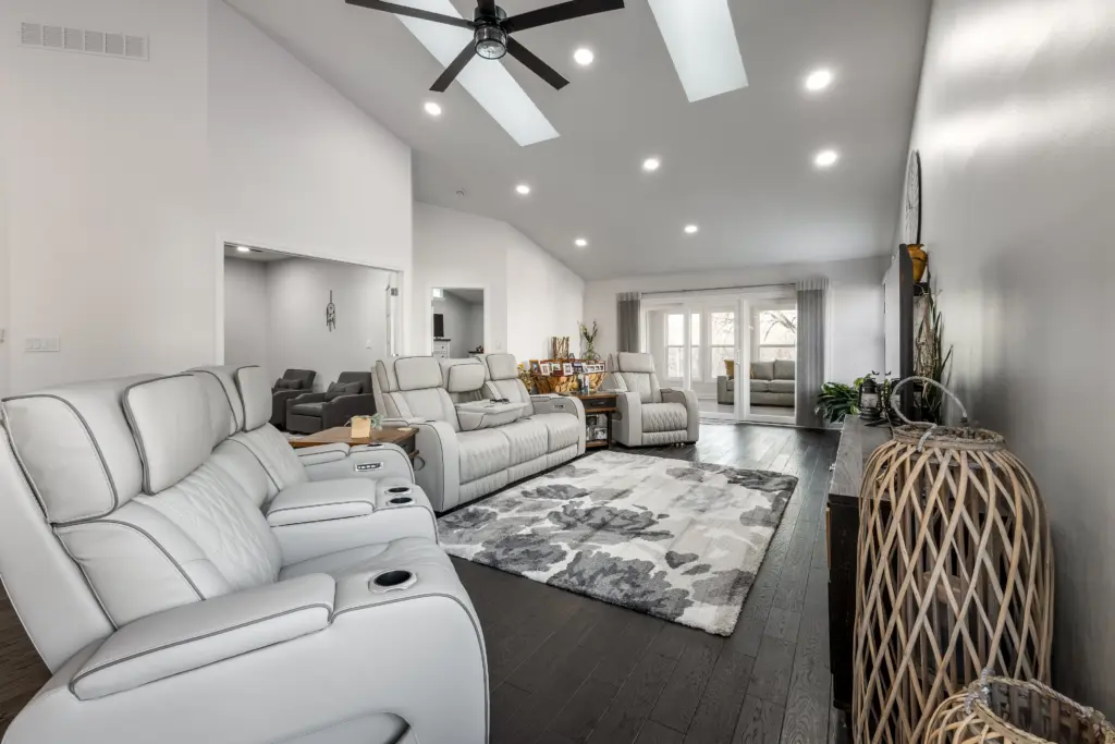 Open living room renovation with vaulted ceilings, recessed lighting, and modern flooring in Indianapolis home remodel