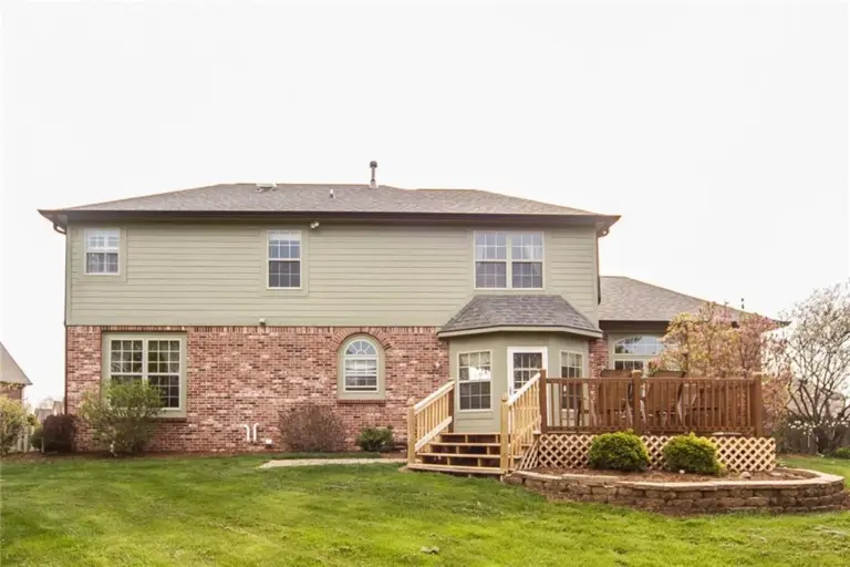 Before photo of residential home in Carmel Indiana before sunroom and deck room addition project