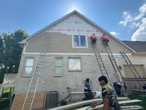 Storm damage siding replacement in progress at home in Carmel, Indiana