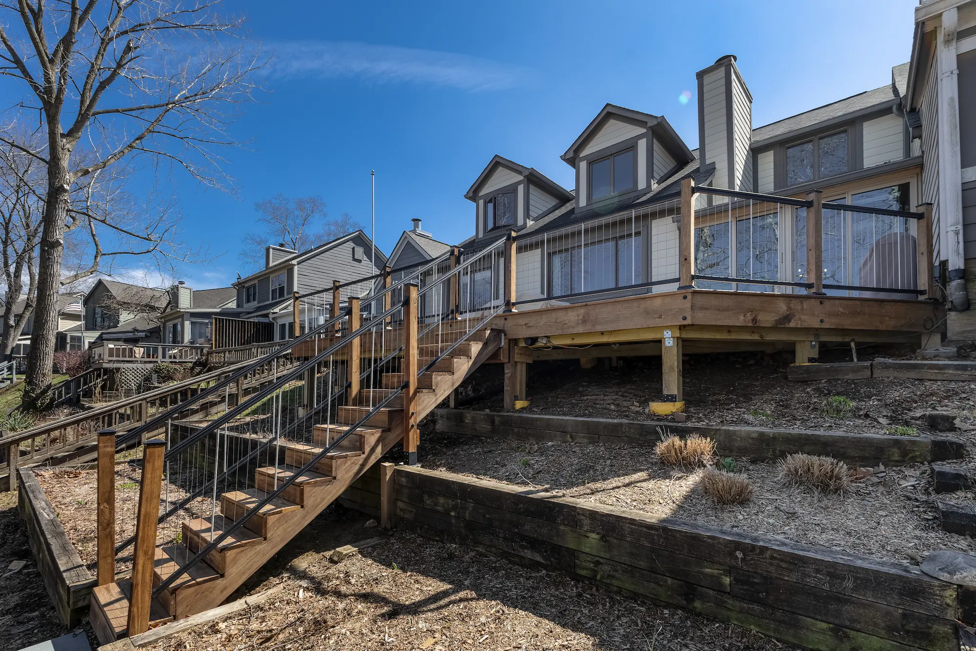 Backyard deck replacement with stairs and cable railing at Indianapolis home