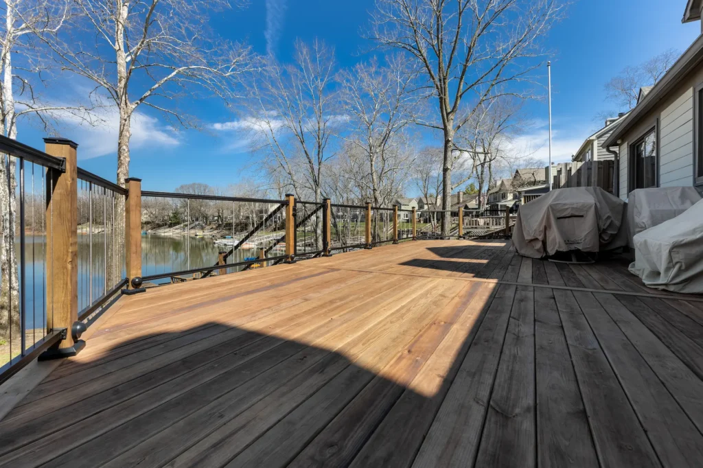 Wood deck replacement with cable railing overlooking lake in Indianapolis, Indiana