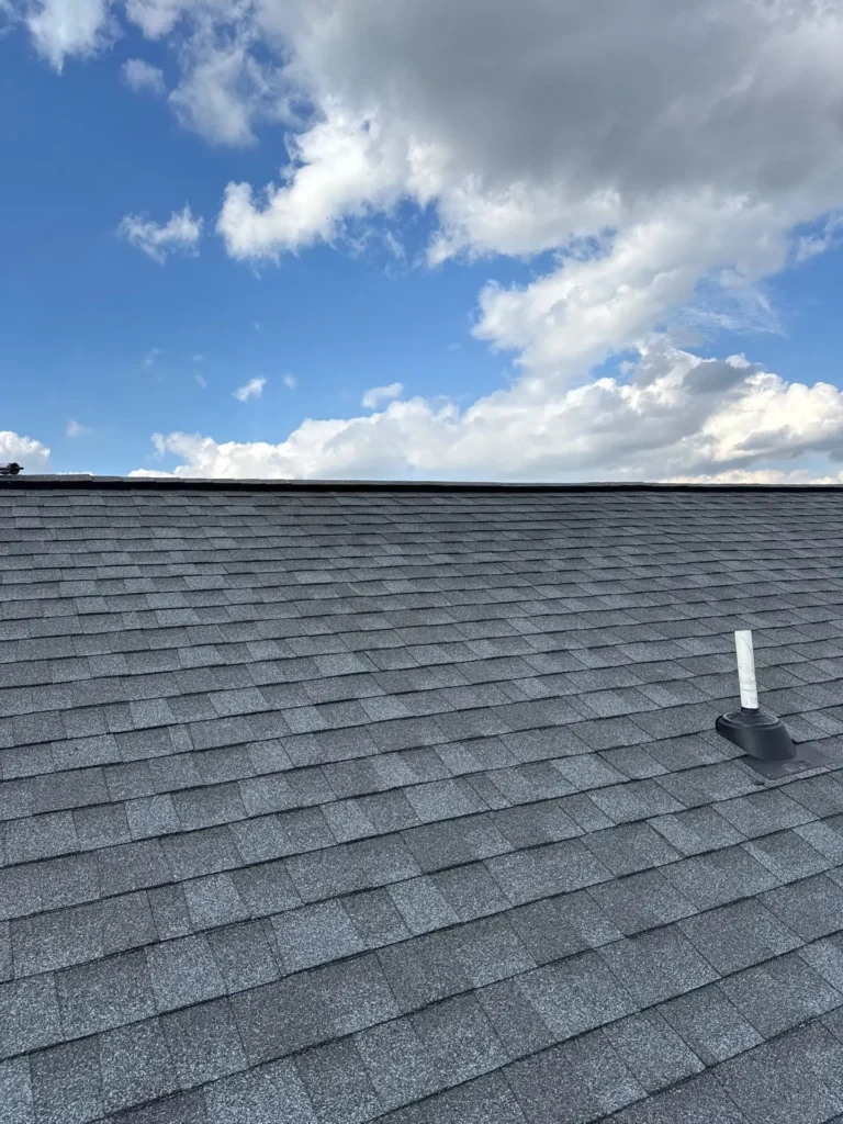 Newly installed gray asphalt shingle roof completed after wind damage replacement project in Noblesville, Indiana