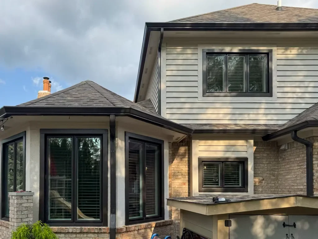 Completed whole-home gutter replacement with Dark Bronze gutters and downspouts in Carmel, Indiana