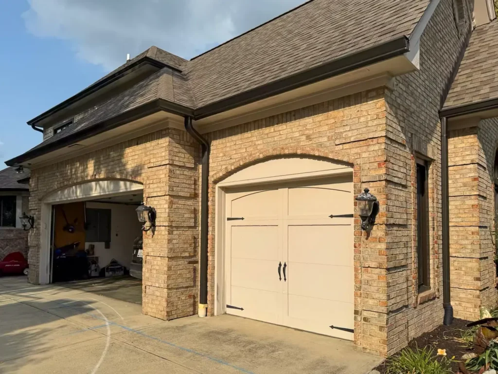 Completed Dark Bronze gutters and downspouts along the garage of a Carmel, Indiana home