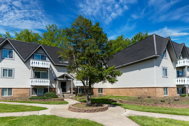 Renovated apartment buildings with updated siding and exterior painting at Camelot East Apartments in Fairfield, Ohio