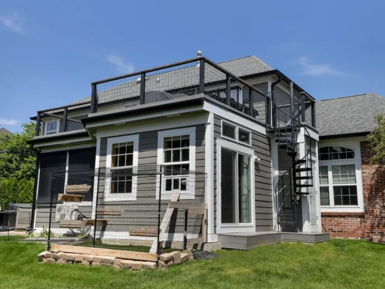Custom outdoor catio built by AY Remodeling and Restoration in Carmel, Indiana, featuring secure wire panels, turf flooring, and wooden climbing shelves for cats.