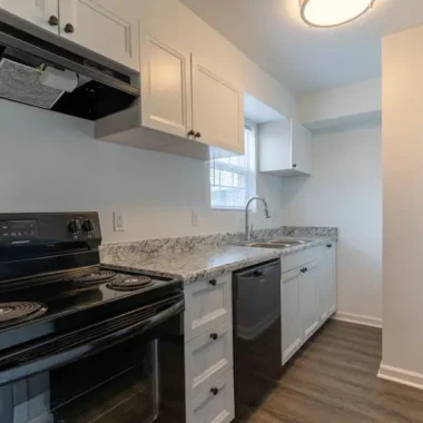 Updated kitchen renovation featuring new cabinets, countertops, and appliances completed by AY Remodeling & Restoration.