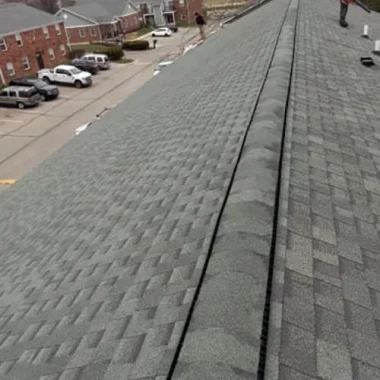 New shingle roof with continuous ridge vent installation on an Westfield, Indiana apartment complex.