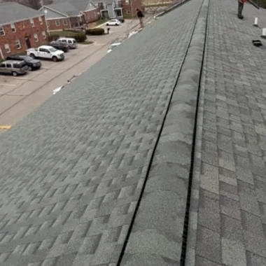 New shingle roof with continuous ridge vent installation on an Westfield, Indiana apartment complex.